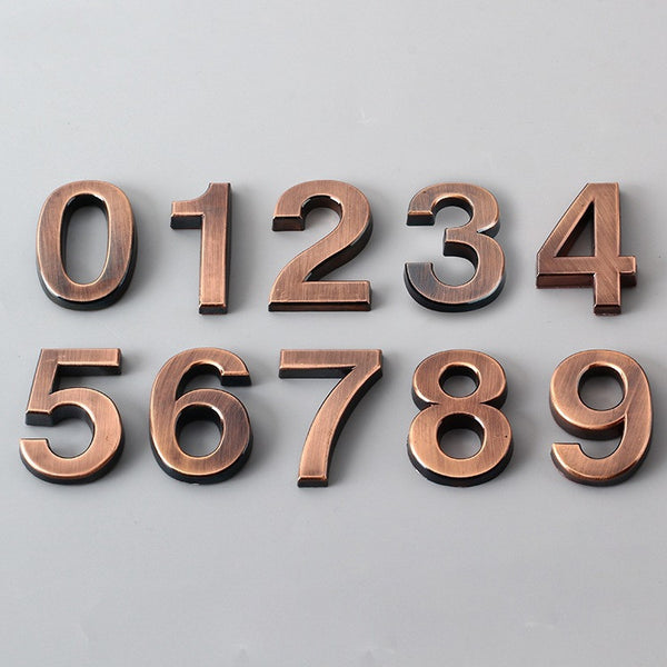 Bronze Digital Sign With Three-dimensional Characters On The Door